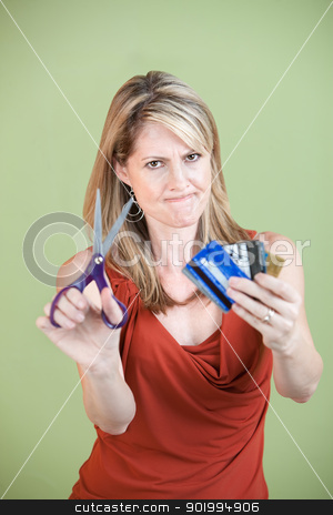 To use this stock image in your creative project, please select the size you need over to the right and click the "Add to Cart" button.
Your downloaded image will come with the Cutcaster watermark removed so don’t worry about the watermark you see on this page. Woman Cuts Credit Cards stock photo, Upset mature woman ready to cut credit cards using scissors by Scott Griessel
