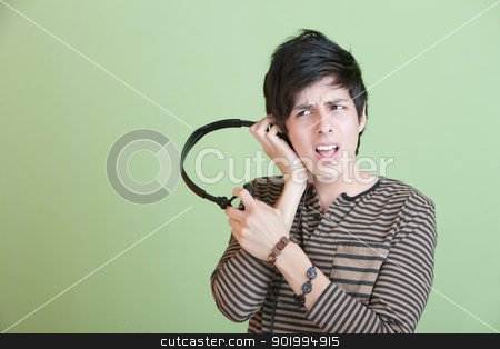 To use this stock image in your creative project, please select the size you need over to the right and click the "Add to Cart" button.
Your downloaded image will come with the Cutcaster watermark removed so don’t worry about the watermark you see on this page. Teen Singing With Music On headphones stock photo, Teen Singing Along with Music On headphones by Scott Griessel