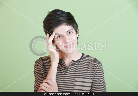 To use this stock image in your creative project, please select the size you need over to the right and click the "Add to Cart" button.
Your downloaded image will come with the Cutcaster watermark removed so don’t worry about the watermark you see on this page. Indecisive Teen stock photo, Young Latino man holds his head over green background by Scott Griessel