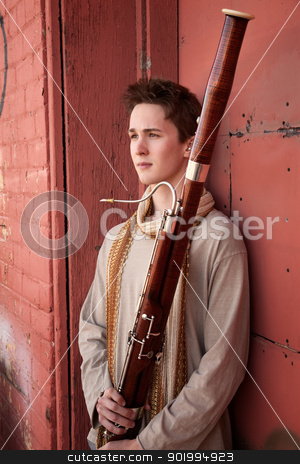To use this stock image in your creative project, please select the size you need over to the right and click the "Add to Cart" button.
Your downloaded image will come with the Cutcaster watermark removed so don’t worry about the watermark you see on this page. Young Bassoon Musician stock photo, Young Caucasian man outside holds a bassoon by Scott Griessel