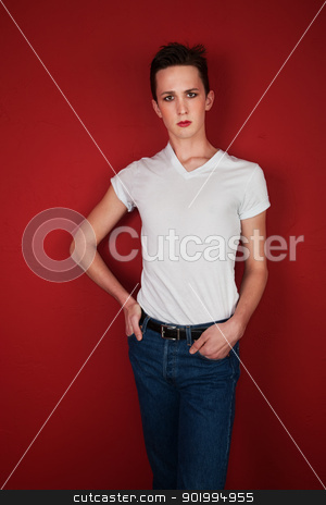 To use this stock image in your creative project, please select the size you need over to the right and click the "Add to Cart" button.
Your downloaded image will come with the Cutcaster watermark removed so don’t worry about the watermark you see on this page. Young Man on Red Background stock photo, Young Caucasian homosexual with his hands in pocket on maroon background by Scott Griessel