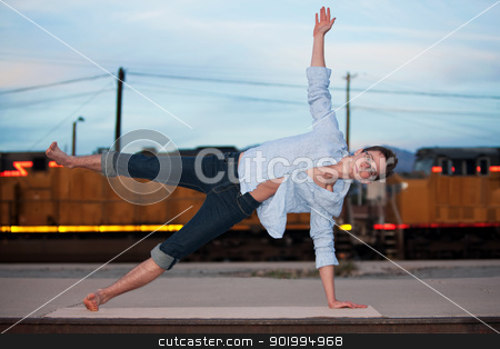 To use this stock image in your creative project, please select the size you need over to the right and click the "Add to Cart" button.
Your downloaded image will come with the Cutcaster watermark removed so don’t worry about the watermark you see on this page. Man in Half Moon Position stock photo, Caucasian man performing the Half Moon yoga position by Scott Griessel