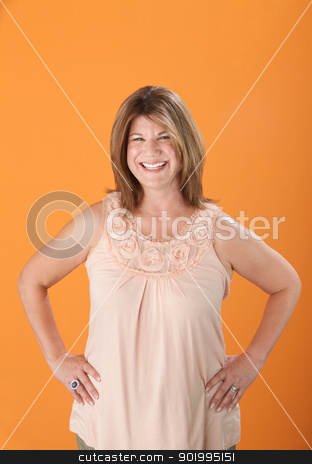 To use this stock image in your creative project, please select the size you need over to the right and click the "Add to Cart" button.
Your downloaded image will come with the Cutcaster watermark removed so don’t worry about the watermark you see on this page. Happy Middle Aged Woman stock photo, Happy middle-aged Caucasian woman on orange background by Scott Griessel