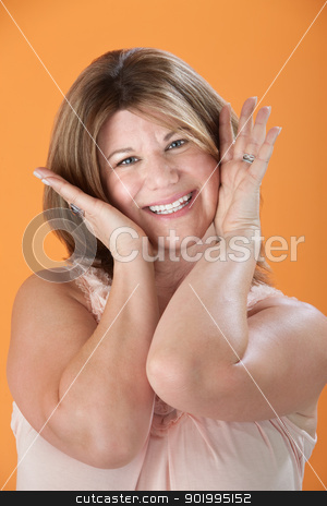 To use this stock image in your creative project, please select the size you need over to the right and click the "Add to Cart" button.
Your downloaded image will come with the Cutcaster watermark removed so don’t worry about the watermark you see on this page. Happy Middle-aged Woman stock photo, Happy middle-aged Caucasian woman with hands on face by Scott Griessel