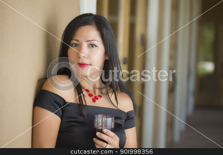 To use this stock image in your creative project, please select the size you need over to the right and click the "Add to Cart" button.
Your downloaded image will come with the Cutcaster watermark removed so don’t worry about the watermark you see on this page. Attractive Hispanic Woman Portrait Outside Enjoying Wine stock photo, Attractive Hispanic Woman Portrait Outside Enjoying a Glass of Wine. by Andy Dean