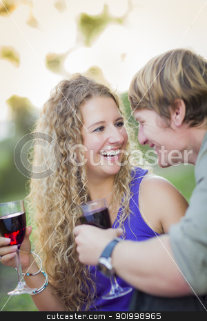 To use this stock image in your creative project, please select the size you need over to the right and click the "Add to Cart" button.
Your downloaded image will come with the Cutcaster watermark removed so don’t worry about the watermark you see on this page. An Attractive Couple Enjoying A Glass Of Wine in the Park stock photo, An Attractive Couple Enjoying A Glass Of Wine in the Park Together. by Andy Dean