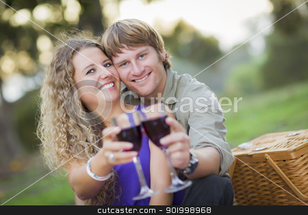 To use this stock image in your creative project, please select the size you need over to the right and click the "Add to Cart" button.
Your downloaded image will come with the Cutcaster watermark removed so don’t worry about the watermark you see on this page. An Attractive Couple Enjoying A Glass Of Wine in the Park stock photo, An Attractive Couple Enjoying A Glass Of Wine in the Park Together. by Andy Dean