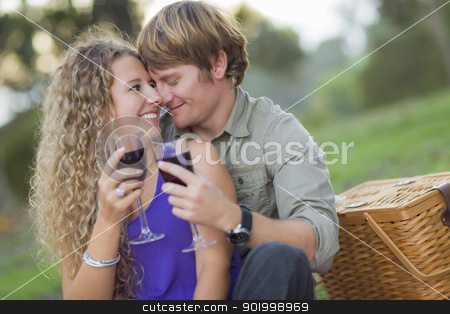 To use this stock image in your creative project, please select the size you need over to the right and click the "Add to Cart" button.
Your downloaded image will come with the Cutcaster watermark removed so don’t worry about the watermark you see on this page. An Attractive Couple Enjoying A Glass Of Wine in the Park stock photo, An Attractive Couple Enjoying A Glass Of Wine in the Park Together. by Andy Dean