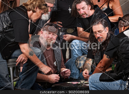 To use this stock image in your creative project, please select the size you need over to the right and click the "Add to Cart" button.
Your downloaded image will come with the Cutcaster watermark removed so don’t worry about the watermark you see on this page. Gang Members Playing Cards stock photo, Serious gang members playing cards and drinking by Scott Griessel