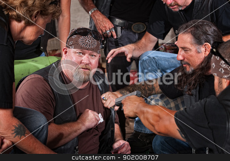 To use this stock image in your creative project, please select the size you need over to the right and click the "Add to Cart" button.
Your downloaded image will come with the Cutcaster watermark removed so don’t worry about the watermark you see on this page. Biker Gang Member Caught Cheating stock photo, Sneaky gang member caught cheating with playing card in pocket by Scott Griessel