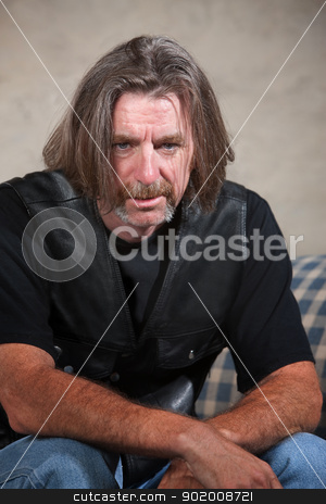 To use this stock image in your creative project, please select the size you need over to the right and click the "Add to Cart" button.
Your downloaded image will come with the Cutcaster watermark removed so don’t worry about the watermark you see on this page. Depressed Biker Gang Member stock photo, Exhausted biker gang man sitting down indoors by Scott Griessel