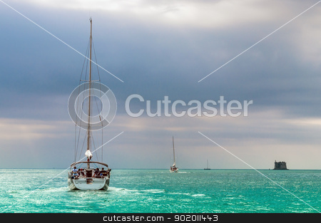 To use this stock image in your creative project, please select the size you need over to the right and click the "Add to Cart" button.
Your downloaded image will come with the Cutcaster watermark removed so don’t worry about the watermark you see on this page. Sailing boat in a azure sea stock photo, Sailing boat in azure sea in a bad weather sky by Alberto Rigamonti