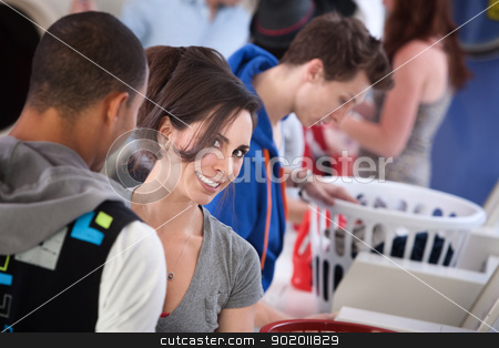To use this stock image in your creative project, please select the size you need over to the right and click the "Add to Cart" button.
Your downloaded image will come with the Cutcaster watermark removed so don’t worry about the watermark you see on this page. Beautiful Lady Smiling stock photo, Young woman with boyfriend smiles in laundromat by Scott Griessel