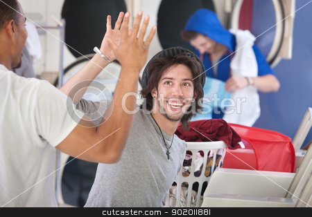To use this stock image in your creative project, please select the size you need over to the right and click the "Add to Cart" button.
Your downloaded image will come with the Cutcaster watermark removed so don’t worry about the watermark you see on this page. Laundromat Friends stock photo, Two happy young friends high five in the laundromat by Scott Griessel