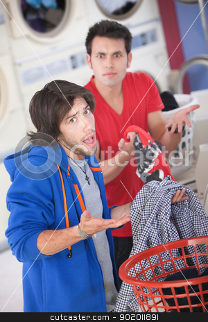 To use this stock image in your creative project, please select the size you need over to the right and click the "Add to Cart" button.
Your downloaded image will come with the Cutcaster watermark removed so don’t worry about the watermark you see on this page. Clothing Switch stock photo, Latino and Caucasian men can't explain clothing switch in laundromat by Scott Griessel