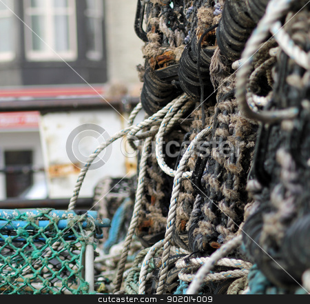 To use this stock image in your creative project, please select the size you need over to the right and click the "Add to Cart" button.
Your downloaded image will come with the Cutcaster watermark removed so don’t worry about the watermark you see on this page. Lobster pots or creels stock photo, Lobster pots or creels, Scarborough harbor, England. by Martin Crowdy