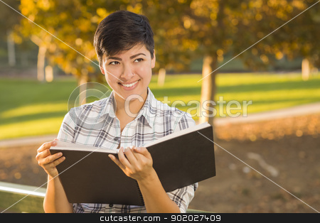 To use this stock image in your creative project, please select the size you need over to the right and click the "Add to Cart" button.
Your downloaded image will come with the Cutcaster watermark removed so don’t worry about the watermark you see on this page. Mixed Race Young Female Holding Open Book and Pencil Outdoors stock photo, Portrait of a Pretty Mixed Race Female Holding Open Book Outdoors at the Park on a Sunny Afternoon. by Andy Dean