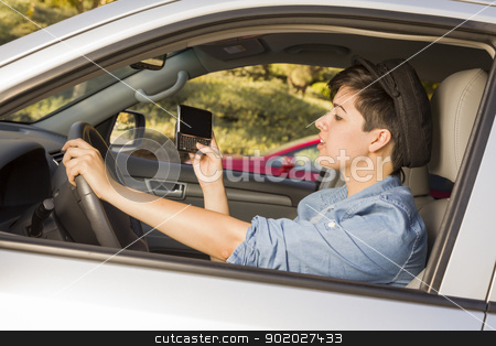 To use this stock image in your creative project, please select the size you need over to the right and click the "Add to Cart" button.
Your downloaded image will come with the Cutcaster watermark removed so don’t worry about the watermark you see on this page. Mixed Race Woman Texting and Driving stock photo, Mixed Race Woman with Smart Phone Texting and Driving. by Andy Dean