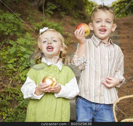 To use this stock image in your creative project, please select the size you need over to the right and click the "Add to Cart" button.
Your downloaded image will come with the Cutcaster watermark removed so don’t worry about the watermark you see on this page. Adorable Children Eating Red Apples Outside stock photo, Two Adorable Children Eating Delicious Red Apples Outside. by Andy Dean