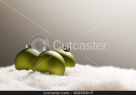 To use this stock image in your creative project, please select the size you need over to the right and click the "Add to Cart" button.
Your downloaded image will come with the Cutcaster watermark removed so don’t worry about the watermark you see on this page. Green Christmas Ornaments on Snow Over a Grey Background stock photo, Green Christmas Ornaments on Snow Flakes Over a Grey Background by Andy Dean