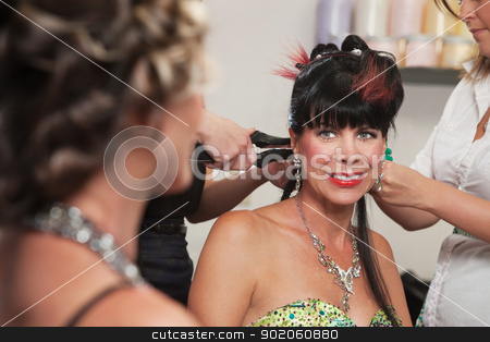 To use this stock image in your creative project, please select the size you need over to the right and click the "Add to Cart" button.
Your downloaded image will come with the Cutcaster watermark removed so don’t worry about the watermark you see on this page. Smiling Lady in Hair Salon stock photo, Smiling woman looking at lady with hair stylists working by Scott Griessel