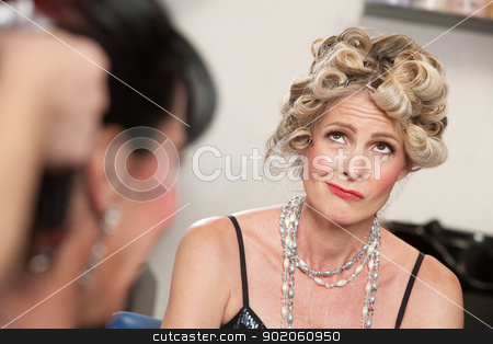 To use this stock image in your creative project, please select the size you need over to the right and click the "Add to Cart" button.
Your downloaded image will come with the Cutcaster watermark removed so don’t worry about the watermark you see on this page. Frowning Lady in Salon stock photo, Frowning European woman with friend in hair salon by Scott Griessel
