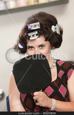 To use this stock image in your creative project, please select the size you need over to the right and click the "Add to Cart" button.
Your downloaded image will come with the Cutcaster watermark removed so don’t worry about the watermark you see on this page. Woman in Curlers Behind Mirror stock photo, Insecure young white female in curlers behind mirror by Scott Griessel