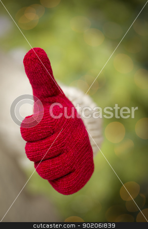 To use this stock image in your creative project, please select the size you need over to the right and click the "Add to Cart" button.
Your downloaded image will come with the Cutcaster watermark removed so don’t worry about the watermark you see on this page. Woman Wearing Red Mittens Holding Out Thumbs Up Hand Sign stock photo, Woman in Sweater with Seasonal Red Mittens Holding Out a Thumb Up Sign with Her Hand. by Andy Dean