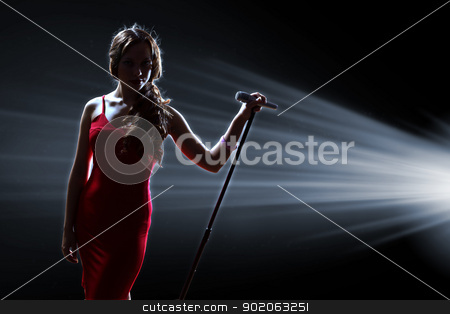 To use this stock image in your creative project, please select the size you need over to the right and click the "Add to Cart" button.
Your downloaded image will come with the Cutcaster watermark removed so don’t worry about the watermark you see on this page. Female singer on the stage stock photo, Female singer on the stage holding a microphone by Sergey Nivens