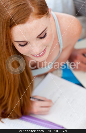 To use this stock image in your creative project, please select the size you need over to the right and click the "Add to Cart" button.
Your downloaded image will come with the Cutcaster watermark removed so don’t worry about the watermark you see on this page. Beautiful teenager doing homework on the floor stock photo, Beautiful teenager doing homework on the floor with her friends by Wavebreak Media