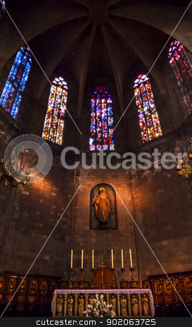 To use this stock image in your creative project, please select the size you need over to the right and click the "Add to Cart" button.
Your downloaded image will come with the Cutcaster watermark removed so don’t worry about the watermark you see on this page. Altar in Old Stone Basilica St Maria del Pi, Saint Mary of Pine stock photo, Stained Windows, Mary Statue, Altar and Crucifix in Old Stone Basilica, St Maria del Pi, Saint Mary of Pine Tree, in Barcelona, Spain. Saint Maria del Pi was founded in 987AD or earlier. One of the oldest churches in Barcelona. by William Perry