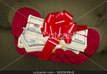 To use this stock image in your creative project, please select the size you need over to the right and click the "Add to Cart" button.
Your downloaded image will come with the Cutcaster watermark removed so don’t worry about the watermark you see on this page. Woman Wearing Mittens Holding Stacks of Money with Red Ribbon stock photo, Woman Wearing Red Mittens and Green Sweater Holding Stacks of Hundreds of Dollars of Money with Red Ribbon. by Andy Dean