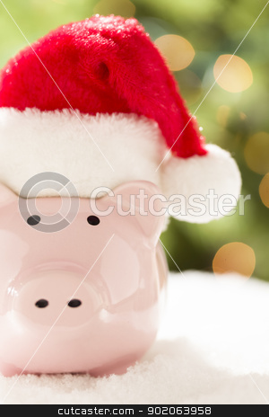 To use this stock image in your creative project, please select the size you need over to the right and click the "Add to Cart" button.
Your downloaded image will come with the Cutcaster watermark removed so don’t worry about the watermark you see on this page. Pink Piggy Bank with Santa Hat on Snowflakes stock photo, Pink Piggy Bank Wearing Red and White Santa Hat on Snowflakes with Abstract Green and Golden Background. by Andy Dean