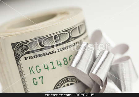 To use this stock image in your creative project, please select the size you need over to the right and click the "Add to Cart" button.
Your downloaded image will come with the Cutcaster watermark removed so don’t worry about the watermark you see on this page. Roll of One Hundred Dollar Bills Tied Silver Bow on White stock photo, Roll of One Hundred Dollar Bills Tied in a Silver Bow on a White Background. by Andy Dean