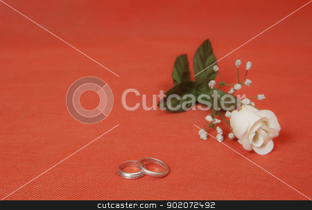 To use this stock image in your creative project, please select the size you need over to the right and click the "Add to Cart" button.
Your downloaded image will come with the Cutcaster watermark removed so don’t worry about the watermark you see on this page. Valentine's day stock photo, Two silver rings with rose in red background by Mola Kaliva
