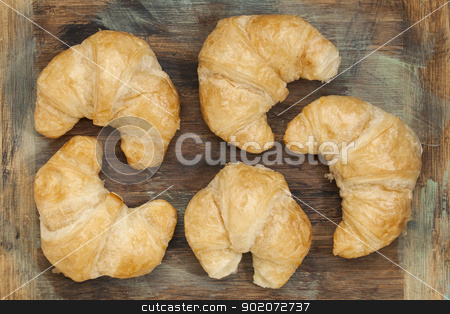 To use this stock image in your creative project, please select the size you need over to the right and click the "Add to Cart" button.
Your downloaded image will come with the Cutcaster watermark removed so don’t worry about the watermark you see on this page. croissant bakery stock photo, croissant rolls on a grunge painted wood board by Marek Uliasz