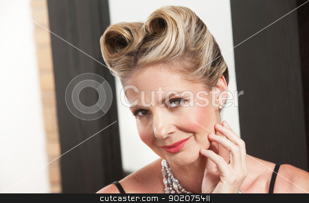 To use this stock image in your creative project, please select the size you need over to the right and click the "Add to Cart" button.
Your downloaded image will come with the Cutcaster watermark removed so don’t worry about the watermark you see on this page. Gorgeous Woman stock photo, One gorgeous Caucasian female with stylish hairdo by Scott Griessel