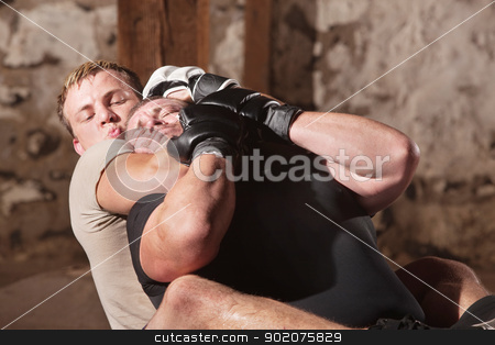 To use this stock image in your creative project, please select the size you need over to the right and click the "Add to Cart" button.
Your downloaded image will come with the Cutcaster watermark removed so don’t worry about the watermark you see on this page. Man in Rear Choke Hold stock photo, European MMA athlete strangles opponent from behind by Scott Griessel