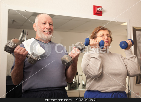 To use this stock image in your creative project, please select the size you need over to the right and click the "Add to Cart" button.
Your downloaded image will come with the Cutcaster watermark removed so don’t worry about the watermark you see on this page. Senior Adult Couple Working Out in the Gym stock photo, Active Senior Adult Couple Working Out in the Gym. by Andy Dean