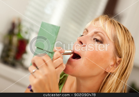 To use this stock image in your creative project, please select the size you need over to the right and click the "Add to Cart" button.
Your downloaded image will come with the Cutcaster watermark removed so don’t worry about the watermark you see on this page. Blonde Woman Applying Her Makeup stock photo, Attractive Blonde Woman Applying Her Makeup Indoors. by Andy Dean
