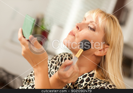 To use this stock image in your creative project, please select the size you need over to the right and click the "Add to Cart" button.
Your downloaded image will come with the Cutcaster watermark removed so don’t worry about the watermark you see on this page. Blonde Woman Applying Her Makeup stock photo, Attractive Blonde Woman Applying Her Makeup Indoors. by Andy Dean