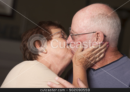 To use this stock image in your creative project, please select the size you need over to the right and click the "Add to Cart" button.
Your downloaded image will come with the Cutcaster watermark removed so don’t worry about the watermark you see on this page. Happy Senior Couple Kissing stock photo, Affectionate Happy Senior Couple Kissing. by Andy Dean