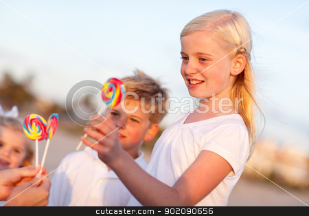 To use this stock image in your creative project, please select the size you need over to the right and click the "Add to Cart" button.
Your downloaded image will come with the Cutcaster watermark removed so don’t worry about the watermark you see on this page. Cute Brother and Sisters Picking out Lollipop stock photo, Cute Brother and Sisters Picking out Lollipop on Afternoon. by Andy Dean
