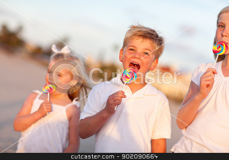 To use this stock image in your creative project, please select the size you need over to the right and click the "Add to Cart" button.
Your downloaded image will come with the Cutcaster watermark removed so don’t worry about the watermark you see on this page. Cute Brother and Sisters Enjoying Their Lollipops Outside stock photo, Cute Brother and Sisters Enjoying Their Lollipops Outside at the Beach. by Andy Dean