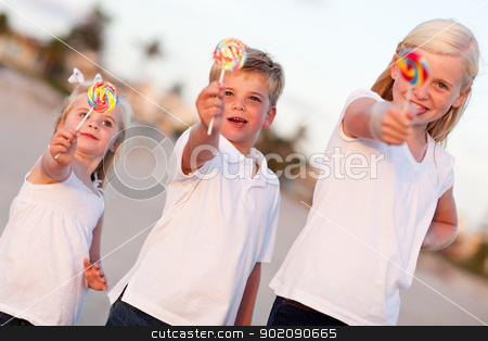 To use this stock image in your creative project, please select the size you need over to the right and click the "Add to Cart" button.
Your downloaded image will come with the Cutcaster watermark removed so don’t worry about the watermark you see on this page. Cute Brother and Sisters Enjoying Their Lollipops Outside stock photo, Cute Brother and Sisters Enjoying Their Lollipops Outside at the Beach. by Andy Dean