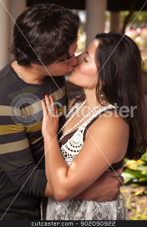 To use this stock image in your creative project, please select the size you need over to the right and click the "Add to Cart" button.
Your downloaded image will come with the Cutcaster watermark removed so don’t worry about the watermark you see on this page. Attractive Hispanic Couple Kissing Outdoors stock photo, Attractive Hispanic Couple Kissing Outdoors in the Park. by Andy Dean