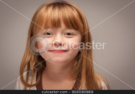 To use this stock image in your creative project, please select the size you need over to the right and click the "Add to Cart" button.
Your downloaded image will come with the Cutcaster watermark removed so don’t worry about the watermark you see on this page. Fun Portrait of an Adorable Red Haired Girl on Grey stock photo, Fun Portrait of an Adorable Red Haired Girl on a Grey Background. by Andy Dean