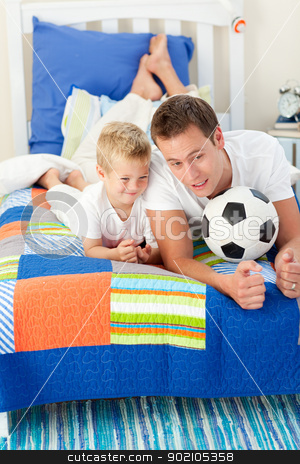 To use this stock image in your creative project, please select the size you need over to the right and click the "Add to Cart" button.
Your downloaded image will come with the Cutcaster watermark removed so don’t worry about the watermark you see on this page. Handsome father and his son playing with a soccer ball stock photo, Handsome father and his son playing with a soccer ball lying on bed by Wavebreak Media