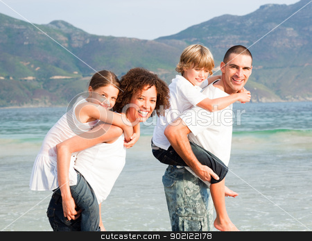 To use this stock image in your creative project, please select the size you need over to the right and click the "Add to Cart" button.
Your downloaded image will come with the Cutcaster watermark removed so don’t worry about the watermark you see on this page. Parents giving two young children piggyback rides stock photo, Parents giving two young children piggyback rides on the beach by Wavebreak Media