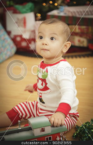 To use this stock image in your creative project, please select the size you need over to the right and click the "Add to Cart" button.
Your downloaded image will come with the Cutcaster watermark removed so don’t worry about the watermark you see on this page. Infant Baby Enjoying Christmas Morning Near The Tree stock photo, Cute Infant Baby Enjoying Christmas Morning Near The Tree. by Andy Dean
